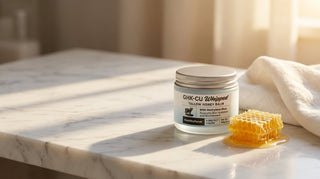 Jar of GHK-Cu copper peptide tallow balm on a bathroom countertop