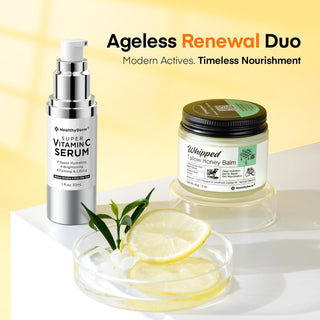 Vitamin C Serum and Tallow Balm Set for Mature Skin displayed with lemon slices, highlighting anti-aging and nourishing skincare benefits.