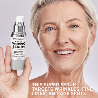 Mature woman holding Vitamin C Serum for Age Spots, highlighting its benefits for reducing wrinkles, fine lines, and age spots.